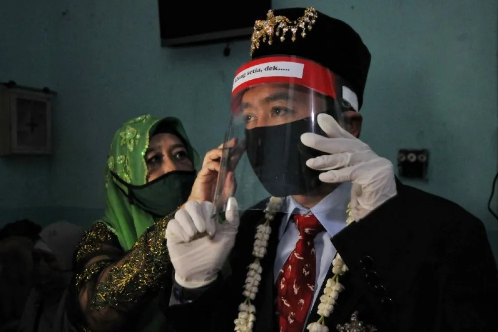 FOTO: Pernikahan di Tengah Pandemi Covid-19