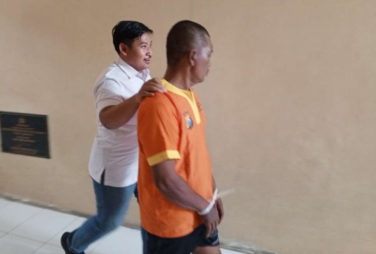 Tersangka saat digelandang petugas. SP/Ist