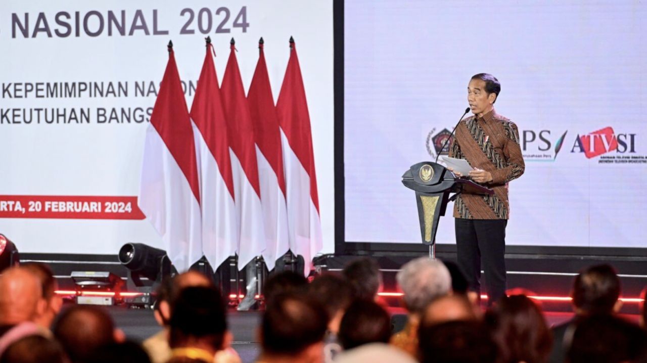 Presiden Jokowi saat mensahkan Perpres Publisher Rights saat puncak acara HPN 2024 pada Selasa (20/2/2024) di Ancol, Jakarta.