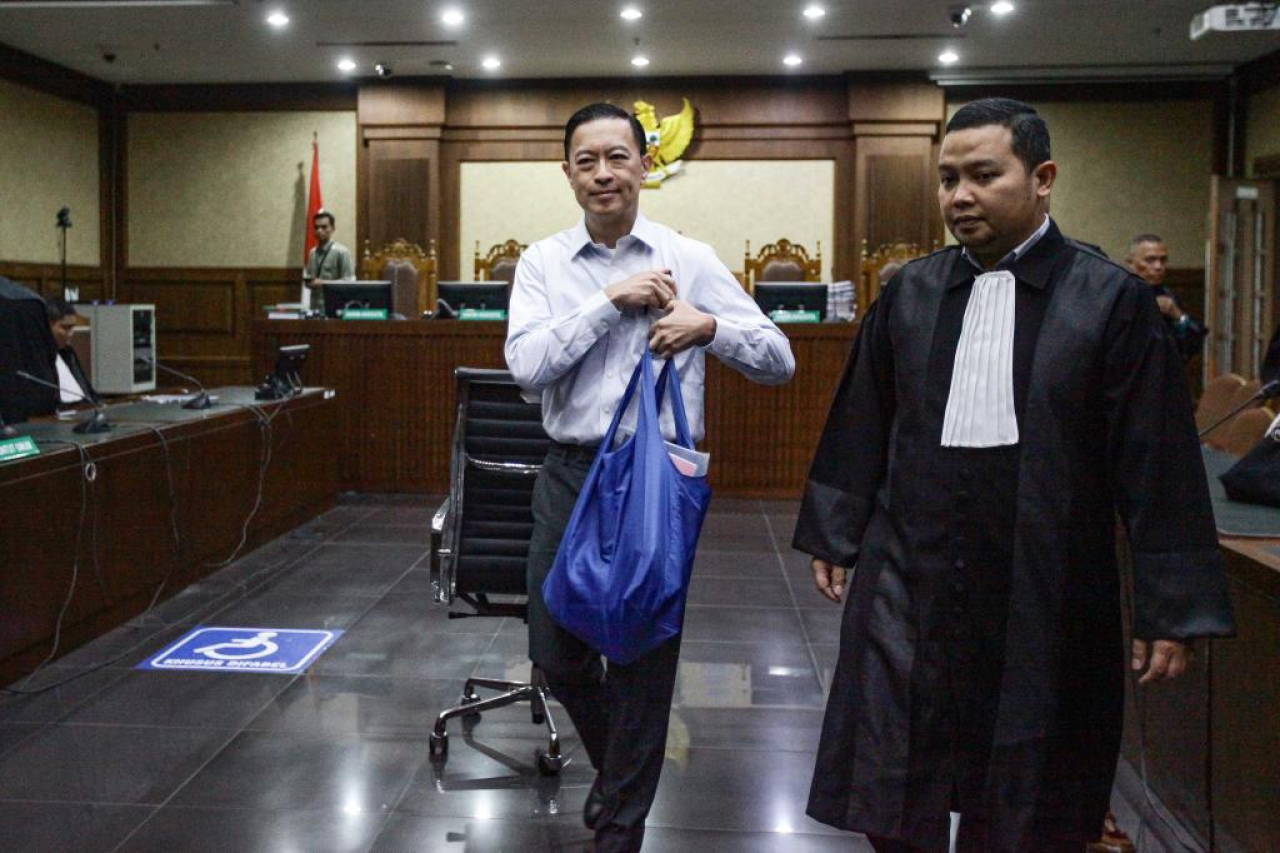 Ekspresi Tom Lembong usai menghadiri sidang pembacaan jawaban eksepsi dari Jaksa Penuntut Umum, Selasa (11/3/2025). Tom Lembong masih keberatan kenapa hanya dirinya yang dibidik.