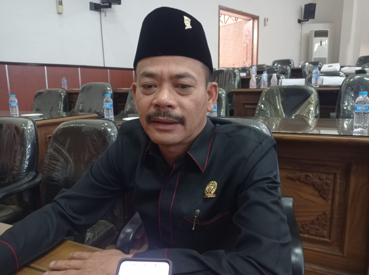 Ketua Fraksi PDI Perjuangan DPRD Kabupaten Madiun, Budi Wahono, ditemui usai rapat paripurna, Jumat (11/7/2025)