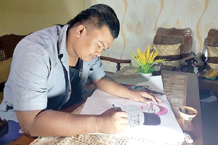 Mochammad Abdul Rochim yang sedang membuat karikatur. SP/ TLG