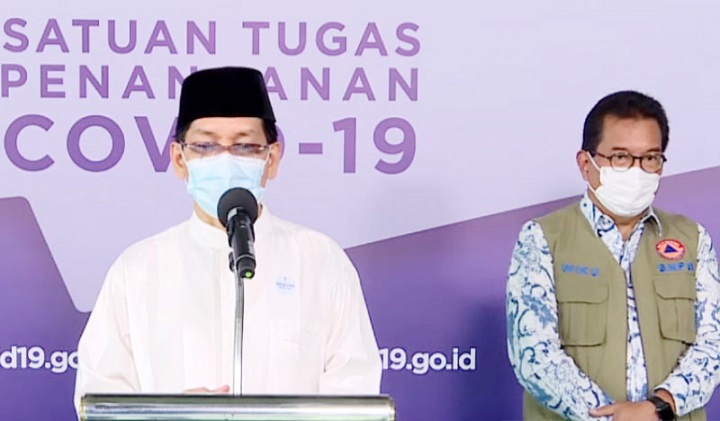 Tangkapan layar saat Amirsyah Tambunan Sekjen MUI (kiri) dan Prof. Wiku Adisasmito Juru Bicara Pemerintah untuk Penanganan Covid-19 dalam konferensi pers di Graha BNPB. SP/BNPB