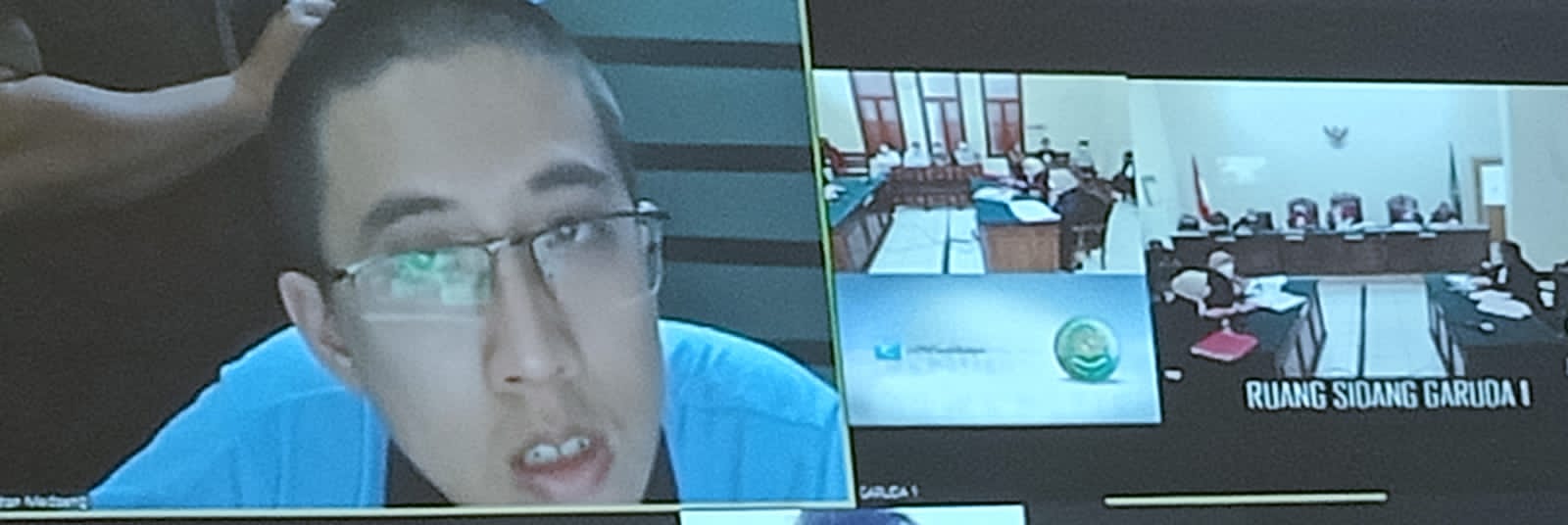 Terdakwa Bryan Malvin saat menjalani persidangan di ruang Garuda 1 PN Surabaya, secara online, Rabu (13/10/2021).