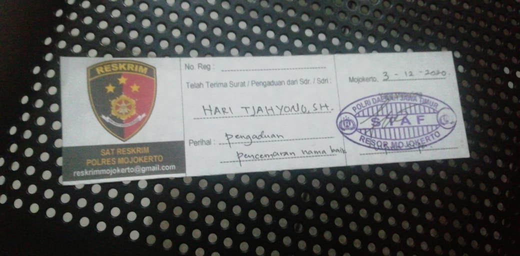 Caption : Bukti laporan kepolisian Kasun Pungging, Surono.