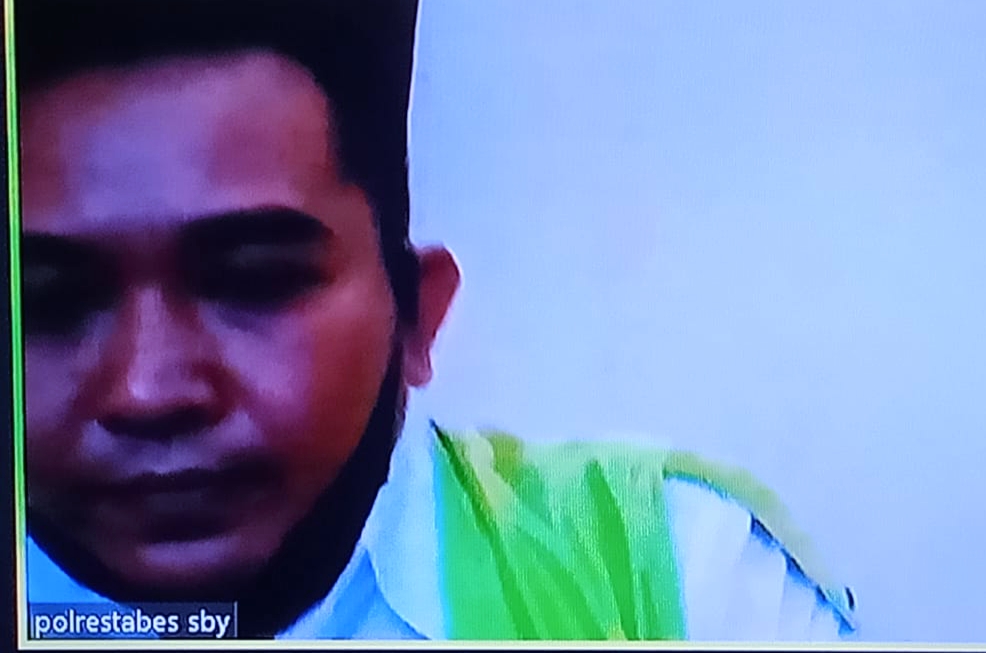 Terdakwa Febrianto Mahendra, menjalani sidang di ruang Cakra, PN.Surabaya, secara online, Rabu (27/01/2021) .SP/BUDI MULYONO.