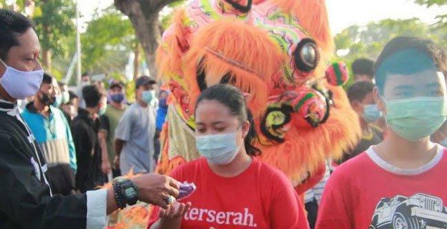 Barongsai yang mengkampanyekan aksi 3M SP/Tribbun