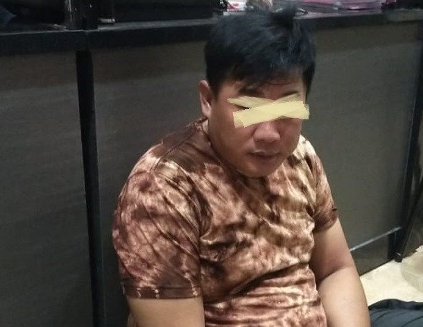 Hudan alias Fajar Herlambang, pelaku penipuan saat diamankan polisi.